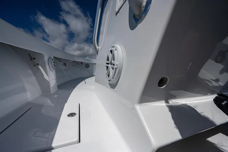 Slide: The Image of 1969 Bertram 25 Moppie boat interior with white deck and blue sky. - 23