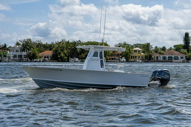 Slide: The Image of 1969 Bertram 25 Moppie boat cruising on a sunny day. - 28