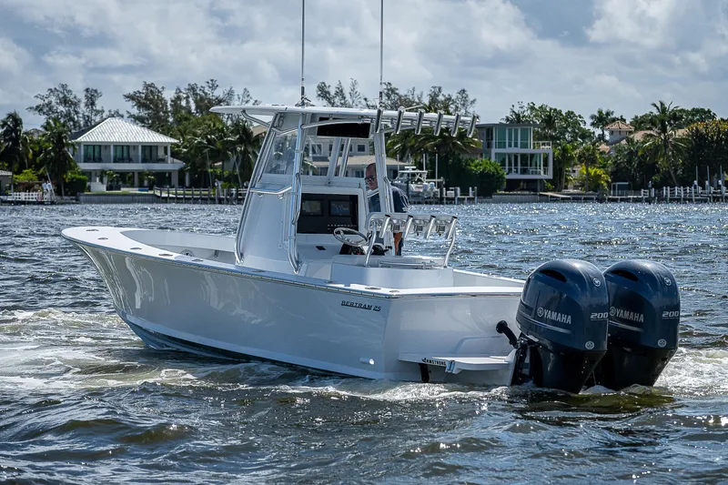 Slide: The Image of 1969 Bertram 25 Moppie boat with twin Yamaha engines on the water. - 34