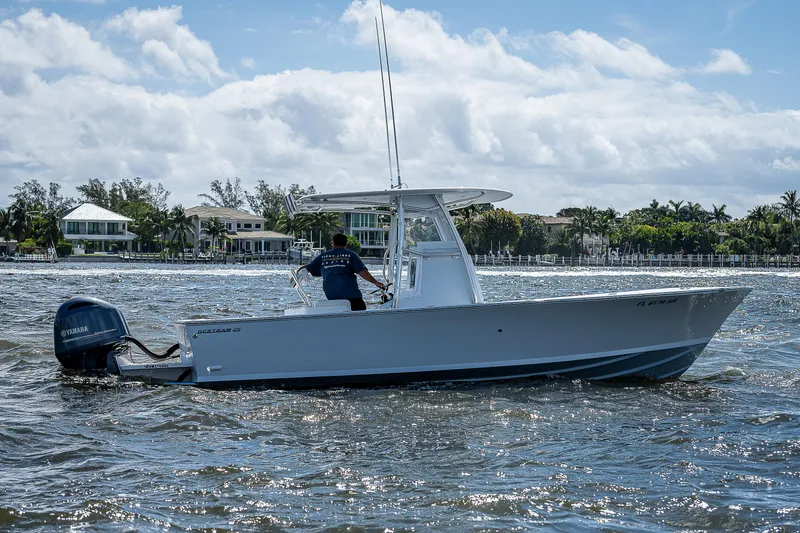 Slide: The Image of 1969 Bertram 25 Moppie boat cruising on a sunny day. - 39