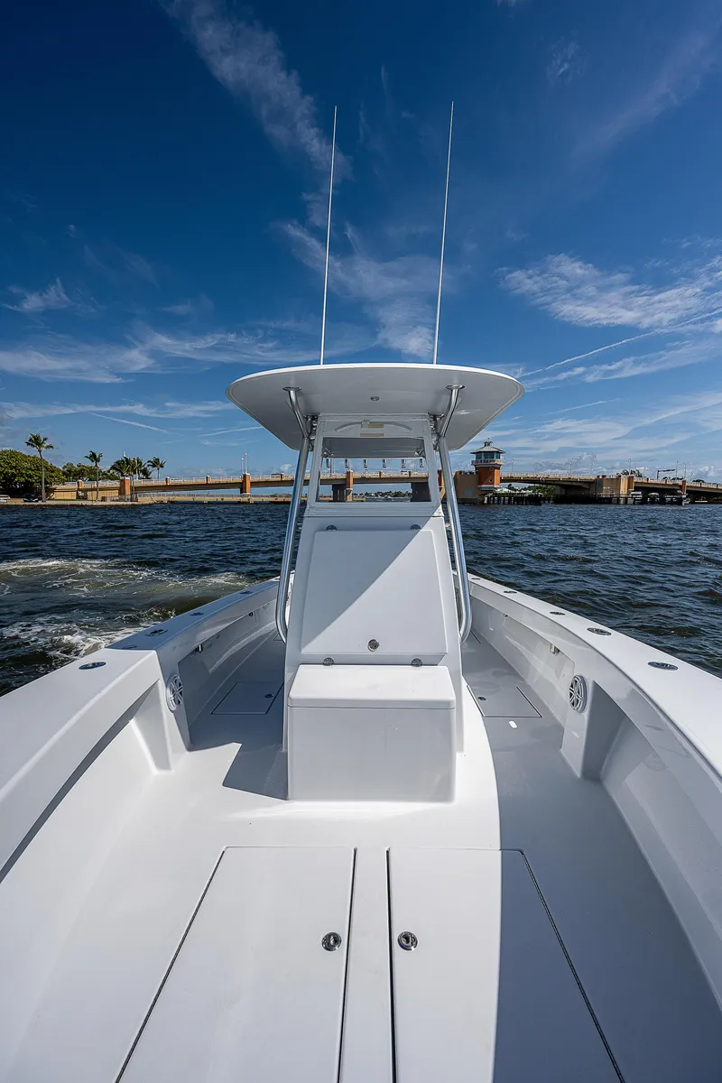 Slide: The Image of 1969 Bertram 25 Moppie boat on open water under clear blue sky. - 6