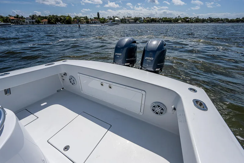 Slide: The Image of 1969 Bertram 25 Moppie boat with twin 200 HP engines on the water. - 9