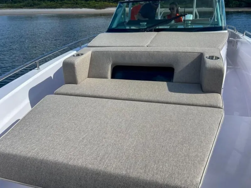 Slide: The Image of 2024 Axopar 37 Sun Top boat with spacious sunbathing area on deck. - 16