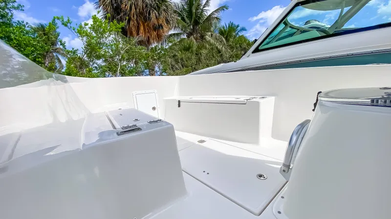 Slide: The Image of 2024 KenCraft 21 boat deck with seating and storage compartments. - 10