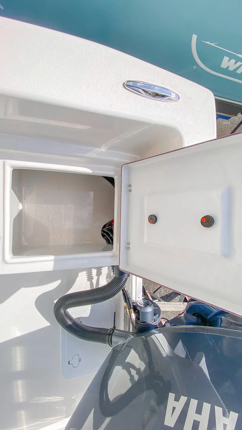 Slide: The Image of 2024 KenCraft 21 boat storage compartment and Yamaha engine. - 14