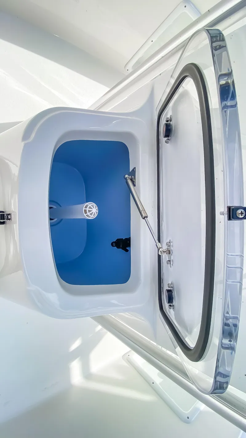 Slide: The Image of 2024 KenCraft 21 boat storage compartment with open hatch. - 15