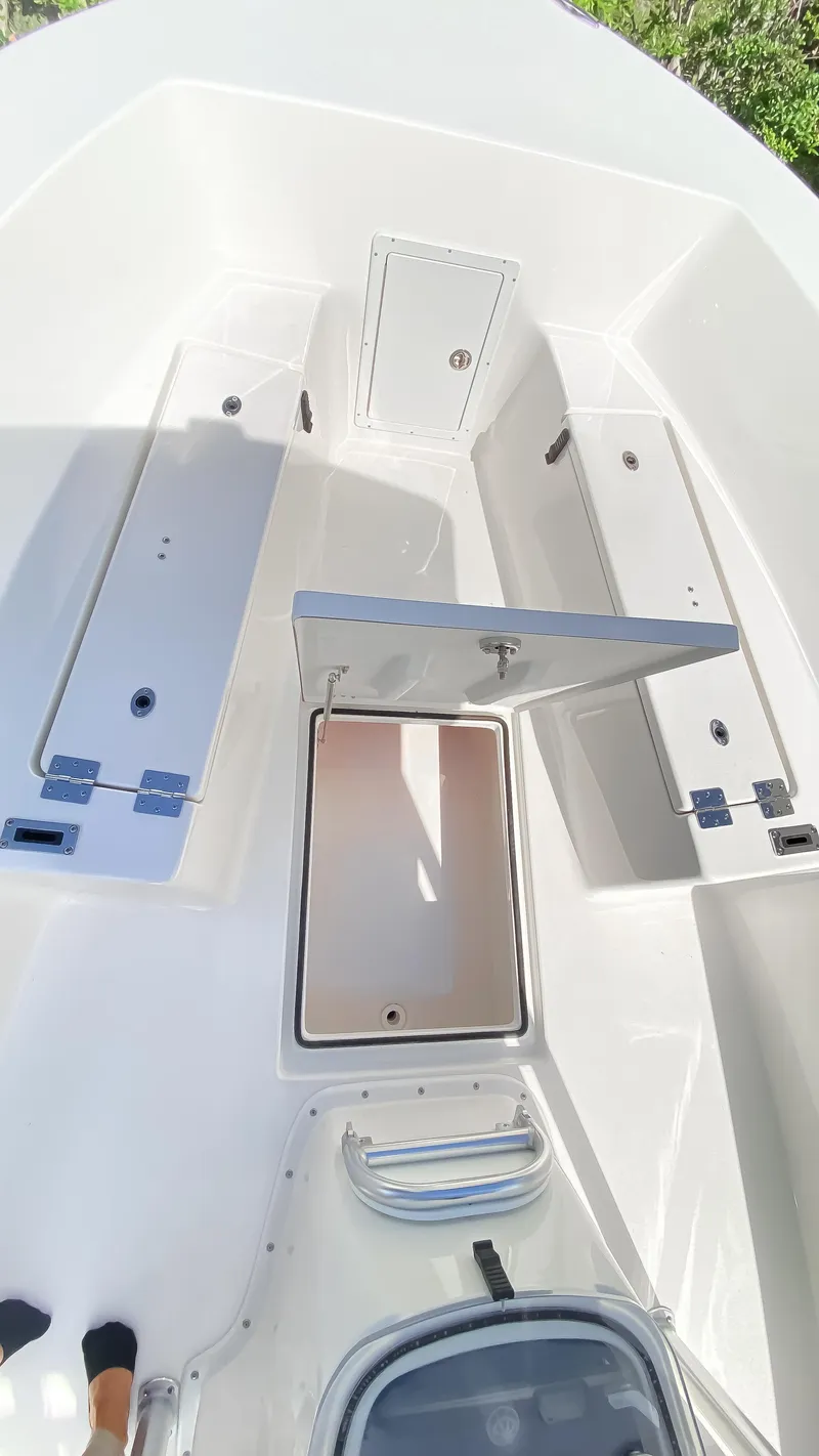 Slide: The Image of 2024 KenCraft 21 boat interior with open storage compartments. - 16