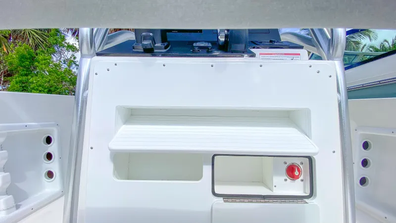 Slide: The Image of 2024 KenCraft 21 boat console with storage compartments and control panel. - 17