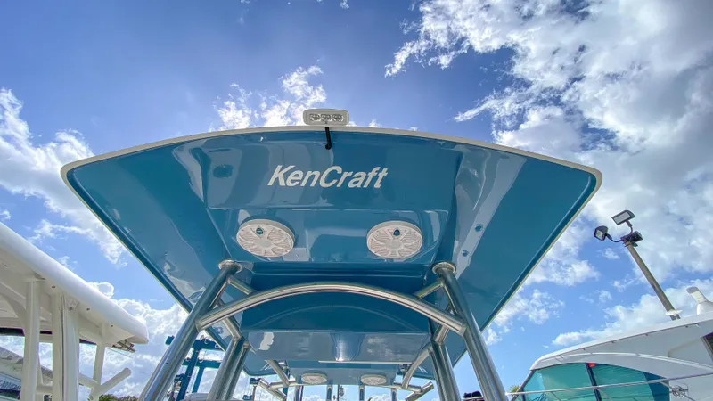 Slide: The Image of KenCraft 21 boat 2024 model under a sunny sky - 18