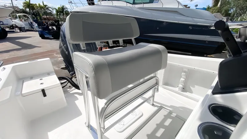 Slide: The Image of 2024 KenCraft 21 boat interior with cushioned seating and modern design. - 6