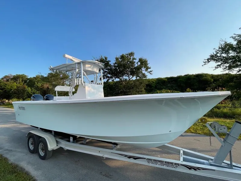 The Image of 2025 Jones Brothers 26 Cape Fisherman boat on trailer in outdoor setting. - 0