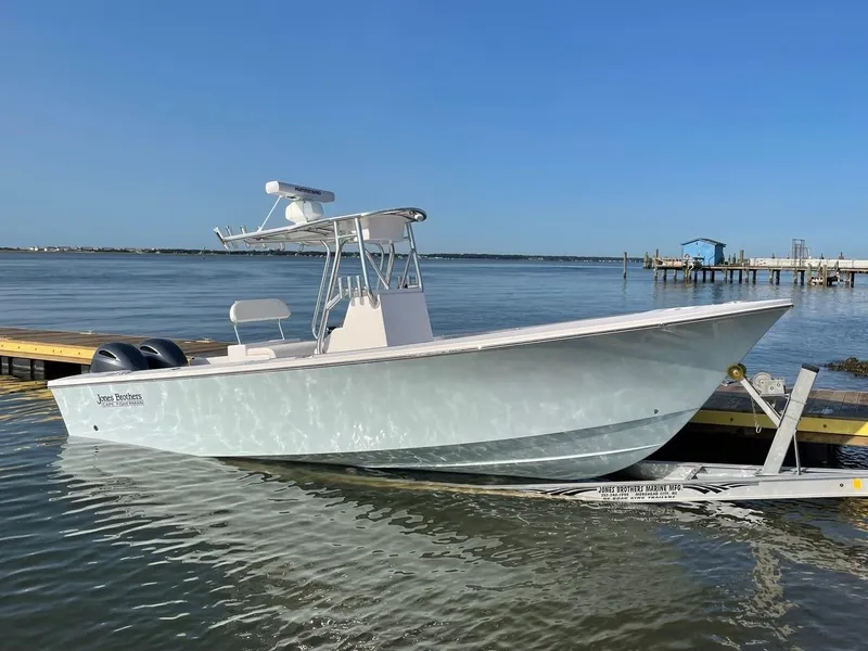 Slide: The Image of 2026 Jones Brothers 26 Cape Fisherman boat advertisement with contact for personalized quote. - 1