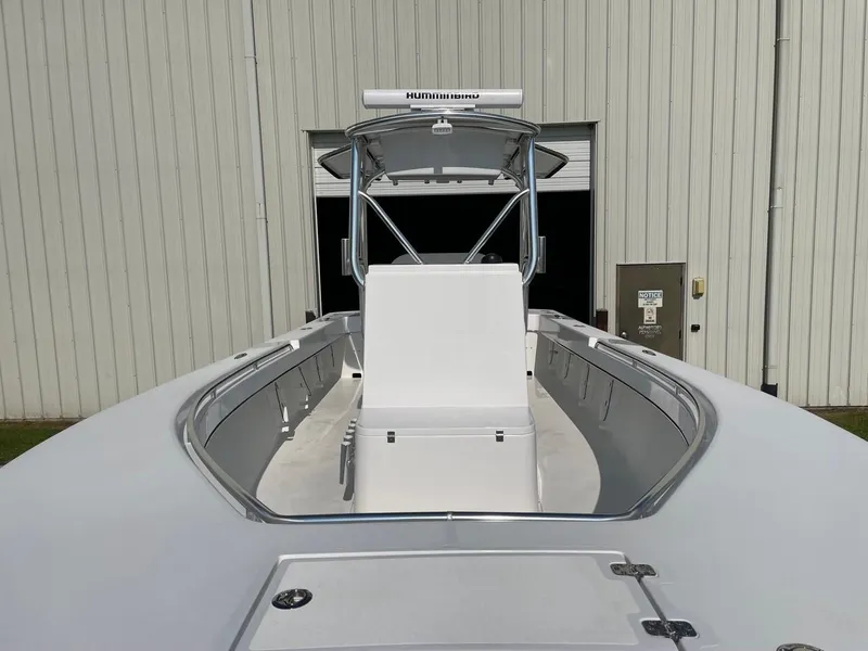 Slide: The Image of 2025 Jones Brothers 26 Cape Fisherman boat under a clear blue sky. - 10