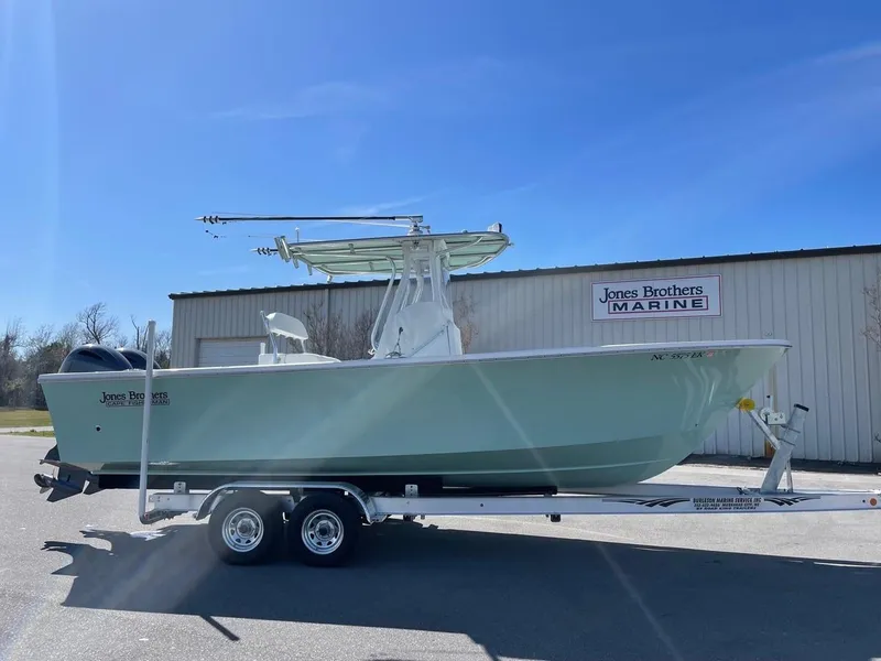Slide: The Image of 2025 Jones Brothers 26 Cape Fisherman boat on trailer outside Jones Brothers Marine building. - 4