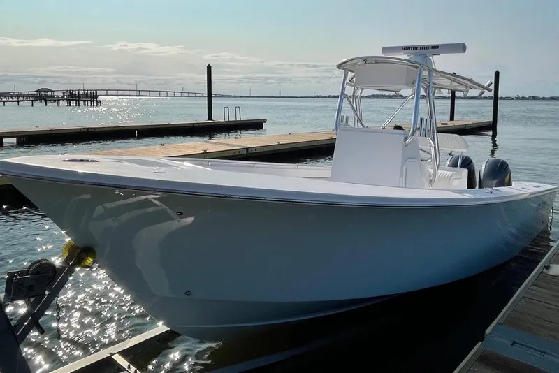 Slide: The Image of 2025 Jones Brothers 26 Cape Fisherman boat on trailer outside Jones Brothers Marine. - 5