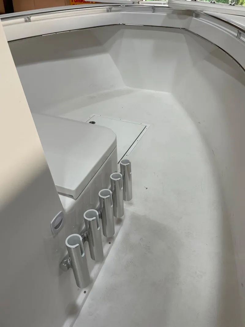 Slide: The Image of 2025 Jones Brothers 26 Cape Fisherman boat with twin Yamaha 150 engines docked. - 7