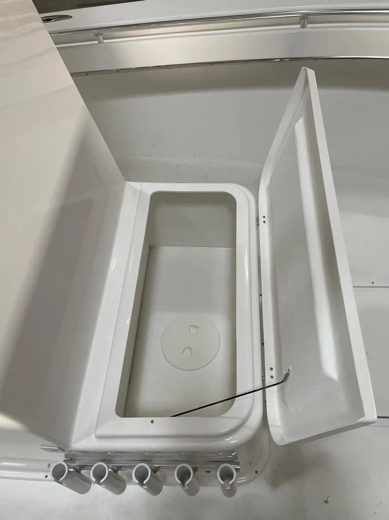 Slide: The Image of 2025 Jones Brothers 26 Cape Fisherman boat interior with rod holders. - 8