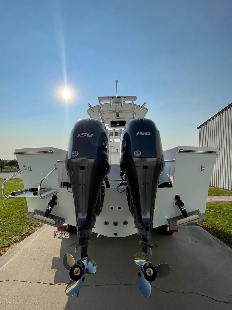 Slide: The Image of 2025 Jones Brothers 26 Cape Fisherman boat on trailer with Yamaha outboard motor. - 16