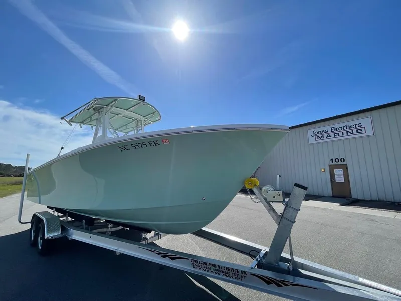 Slide: The Image of 2025 Jones Brothers 26 Cape Fisherman boat on trailer outside Jones Brothers Marine. - 3