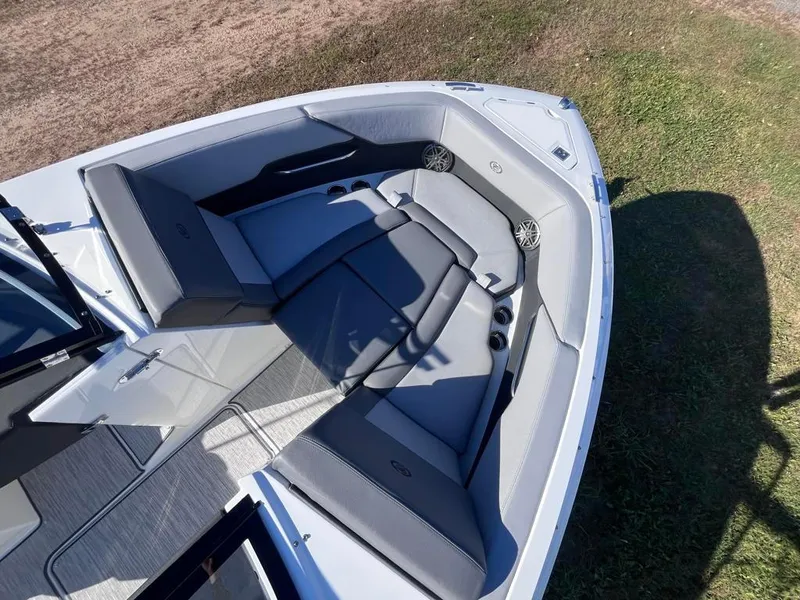 Slide: The Image of 2024 Cobalt CS23 boat interior with gray seating and modern design. - 14