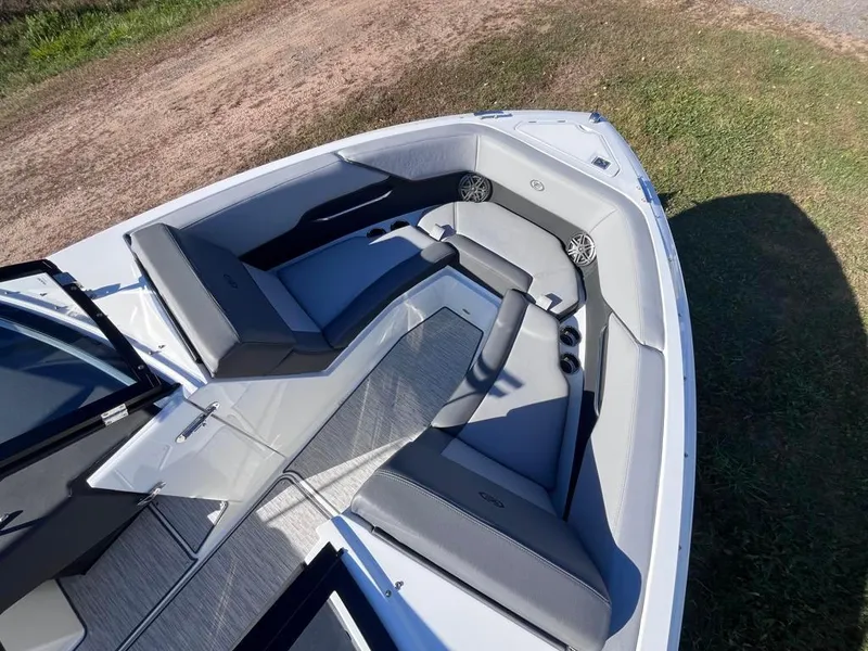 Slide: The Image of 2024 Cobalt CS23 boat interior with sleek gray seating and modern design. - 15