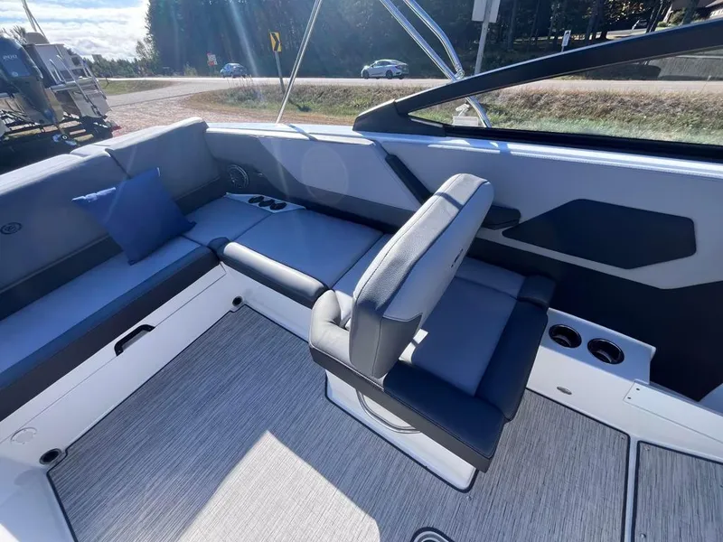 Slide: The Image of 2024 Cobalt CS23 boat interior with modern seating and sleek design. - 28