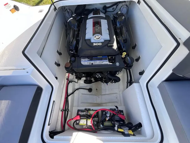 Slide: The Image of 2024 Cobalt CS23 boat engine compartment with 300 HP engine and battery setup. - 32