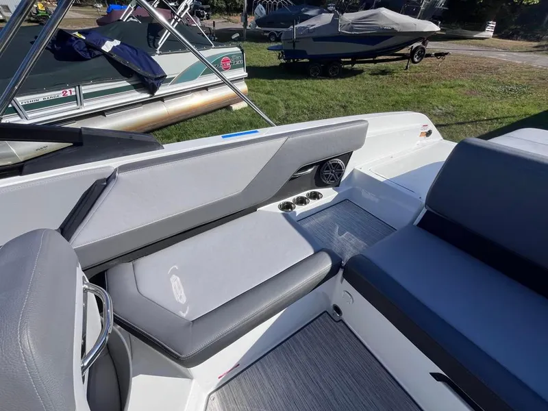 Slide: The Image of 2024 Cobalt CS23 boat interior with gray seating and modern design. - 35