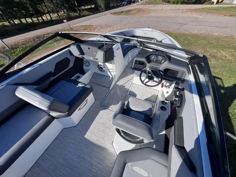 Slide: The Image of 2024 Cobalt CS23 boat interior with modern seating and dashboard design. - 36