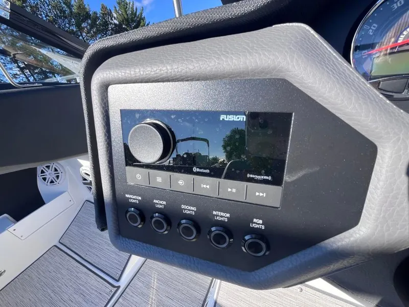 Slide: The Image of 2024 Cobalt CS23 boat dashboard with Fusion audio system and control panel. - 42