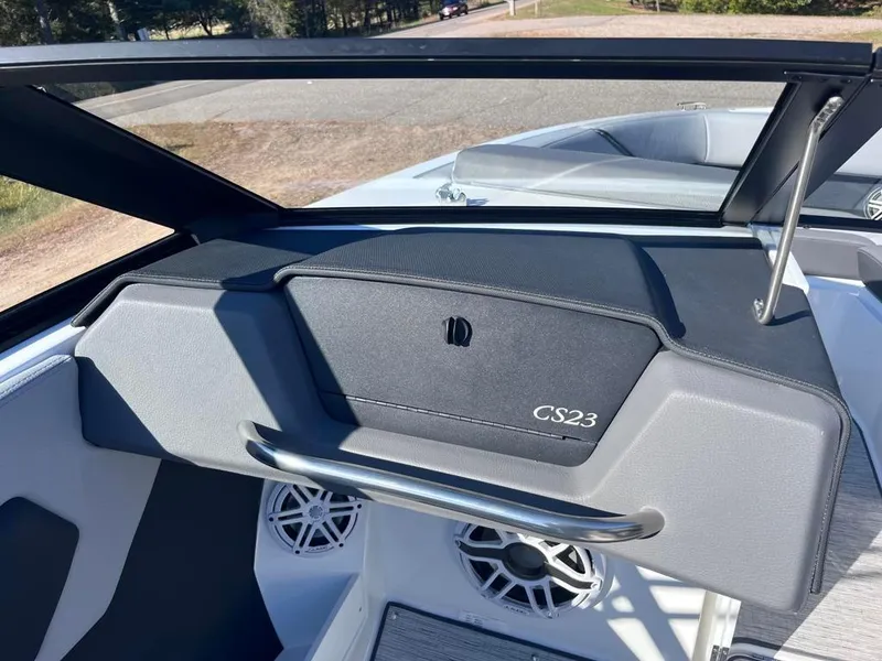 Slide: The Image of 2024 Cobalt CS23 boat dashboard with speakers and sleek design. - 62
