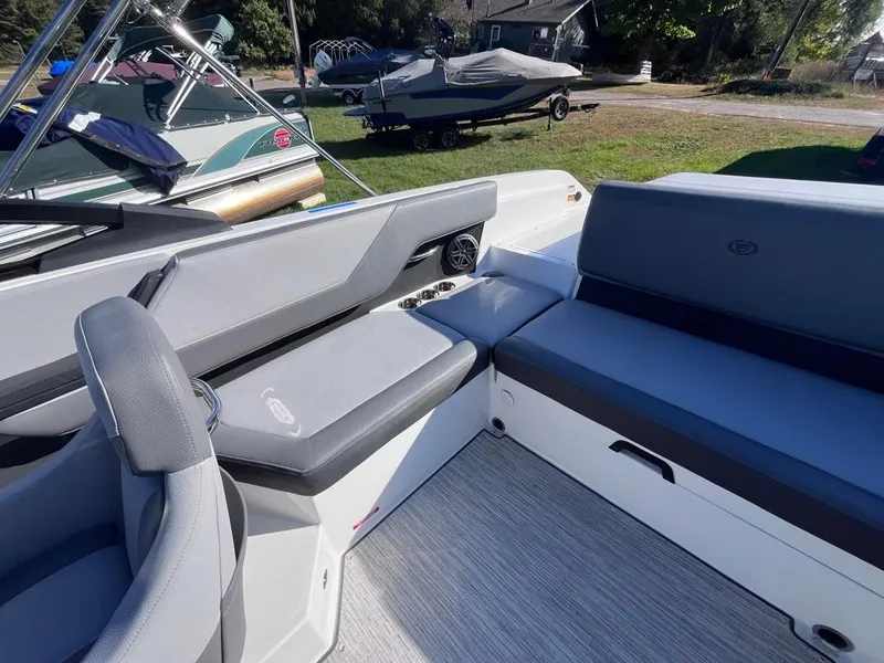 Slide: The Image of 2024 Cobalt CS23 boat interior with gray seating and modern design. - 73