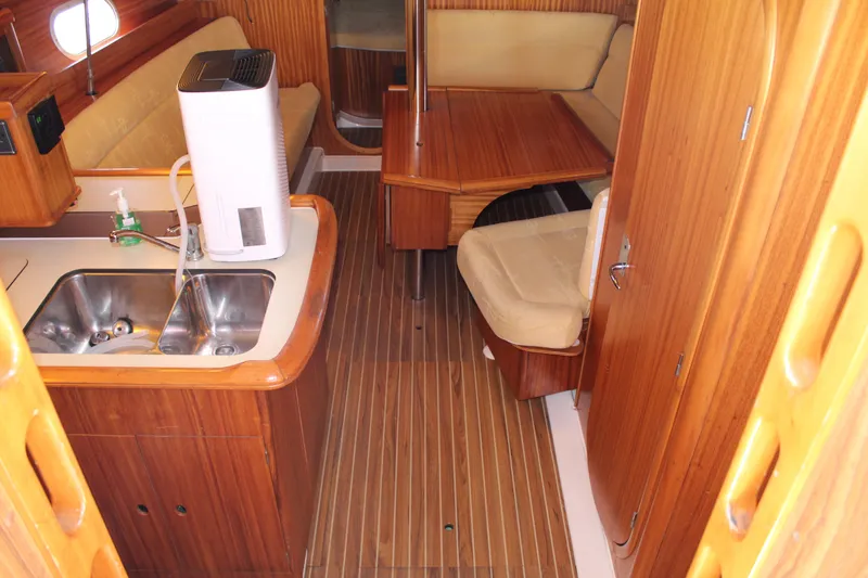 Slide: The Image of Interior of 2003 Dufour Gib Sea 37 sailboat with wooden cabinetry and seating. - 21