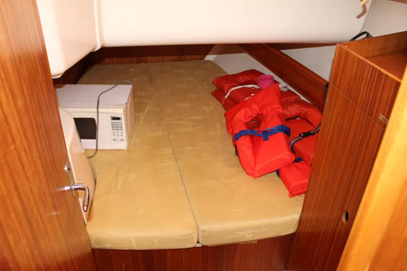 Slide: The Image of Cabin interior of 2003 Dufour Gib Sea 37 with life jackets and microwave. - 35