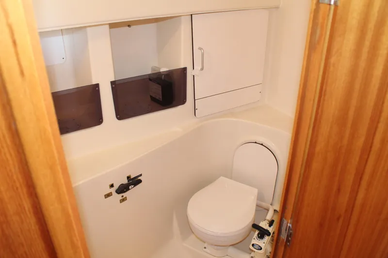 Slide: The Image of Compact bathroom in 2003 Dufour Gib Sea 37 sailboat with toilet and storage cabinets. - 38