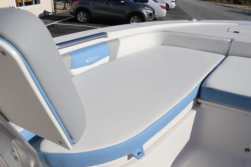 Slide: The Image of 2024 Robalo 206 Cayman boat interior with white and blue seating. - 31