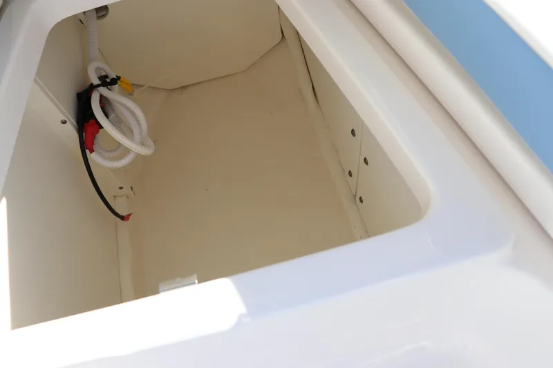 Slide: The Image of 2024 Robalo 206 Cayman storage compartment, spacious and clean design. - 33