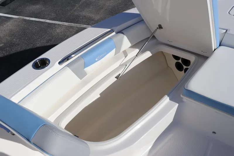 Slide: The Image of 2024 Robalo 206 Cayman boat storage compartment with open lid. - 34