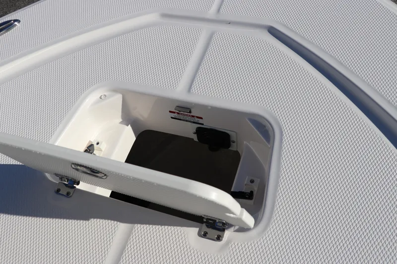 Slide: The Image of 2024 Robalo 206 Cayman boat storage compartment with open hatch. - 36