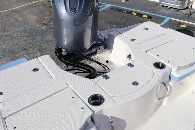 Slide: The Image of 2024 Robalo 206 Cayman boat deck with motor and storage compartments. - 7