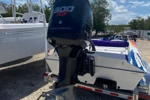 Slide: The Image of 2005 Liberator 21 boat with a 300 XS outboard motor on a trailer. - 5