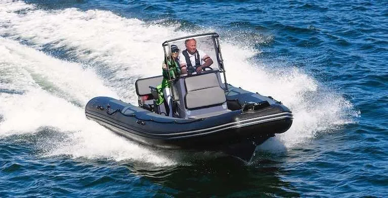 Slide: The Image of 2024 Zodiac Pro 5.5 inflatable boat speeding on water. - 4