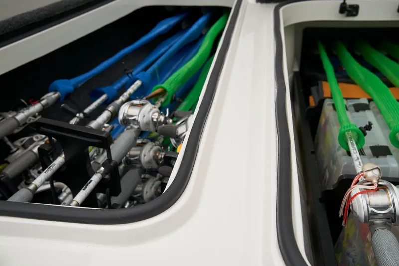 Slide: The Image of 2024 Ranger Z518 Cup-Equipped boat parked in a lot, featuring a Lowrance trolling motor. - 17