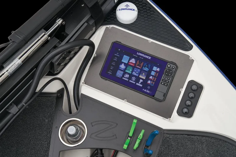 Slide: The Image of 2024 Ranger Z518 Cup-Equipped boat dashboard with Lowrance electronics and steering wheel. - 24