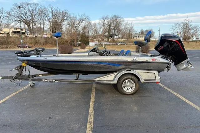 Slide: The Image of 2024 Ranger Z518 Cup-Equipped boat on trailer in parking lot. - 96