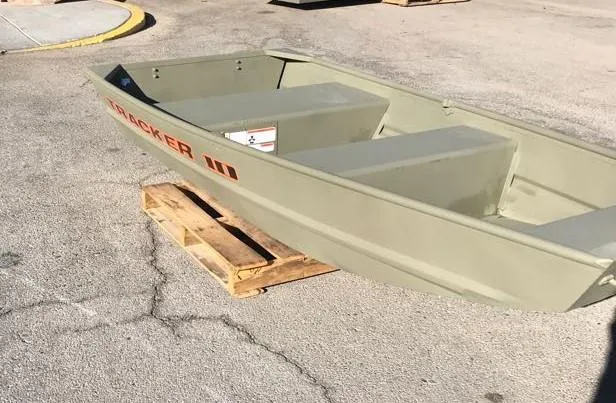 Slide: The Image of 2024 Tracker Grizzly 1036 Jon boat on wooden pallet, outdoor setting. - 3