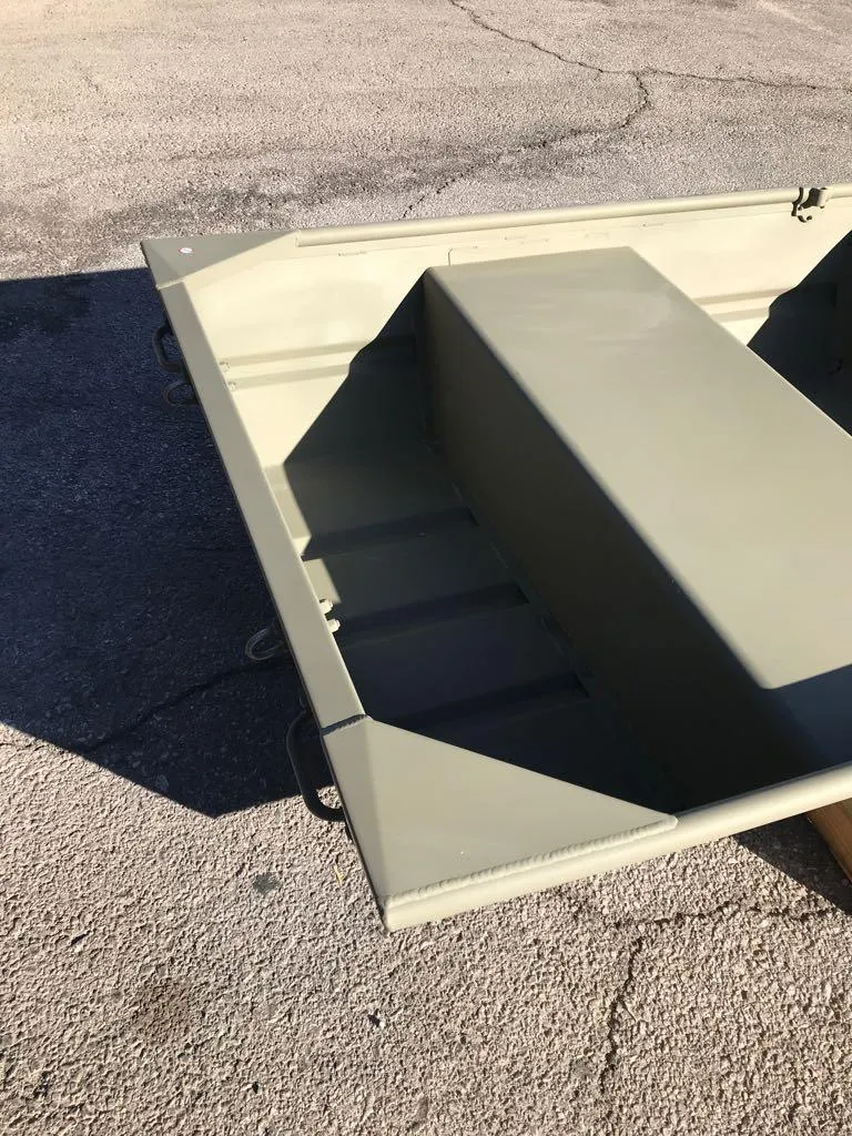 Slide: The Image of 2024 Tracker Grizzly 1036 Jon boat, olive green, on pavement. - 5