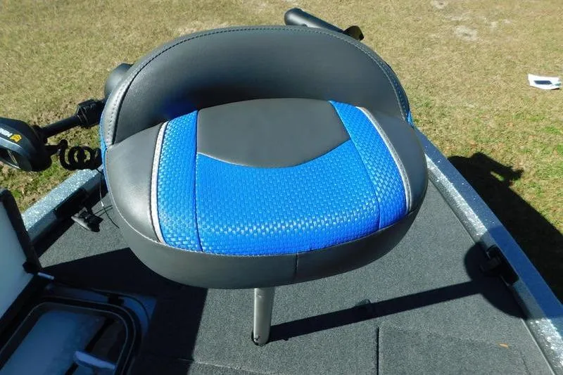 Slide: The Image of 2024 Ranger Z518 boat seat with blue and black upholstery on deck. - 15