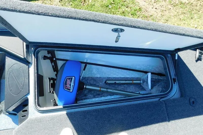 Slide: The Image of 2024 Ranger Z518 boat storage compartment with fishing gear and equipment. - 16