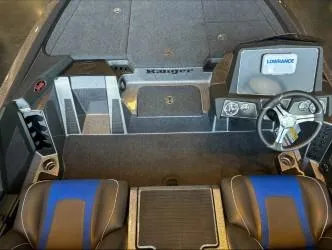 Slide: The Image of 2024 Ranger Z518 boat interior with steering wheel and seating. - 4